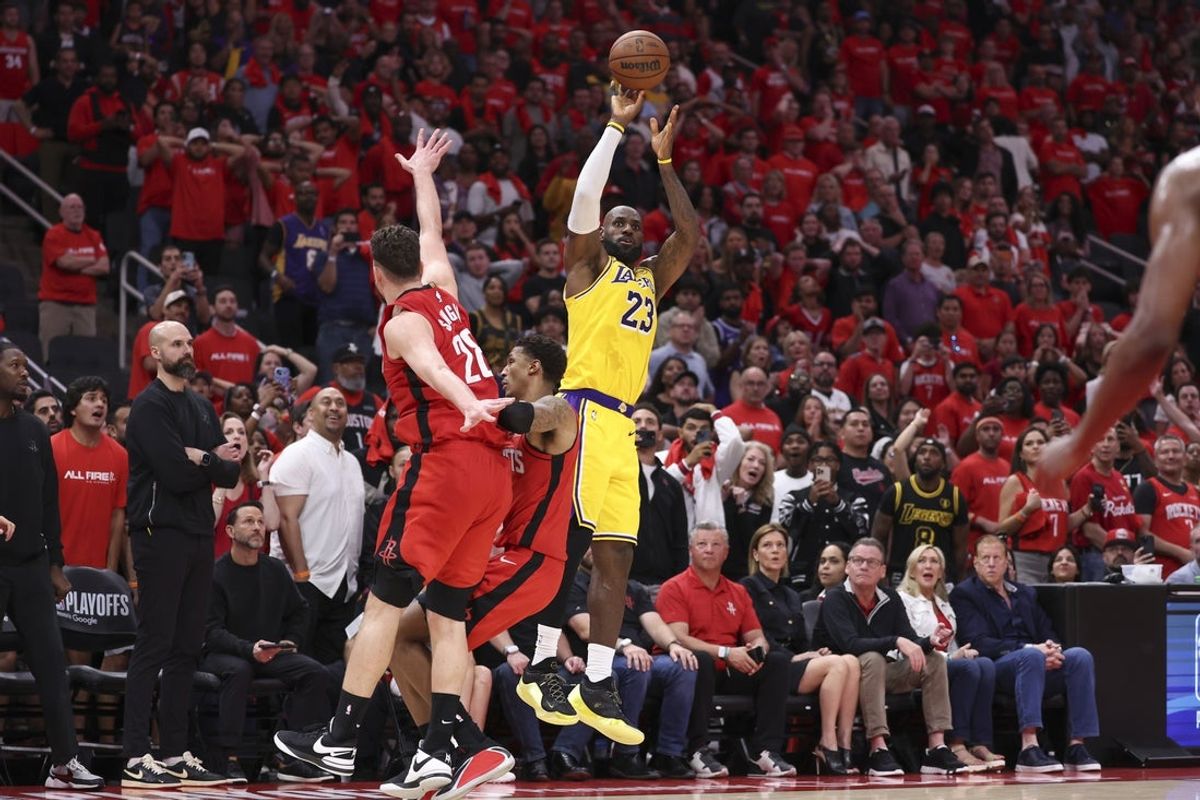 Apr 24, 2026; Houston, Texas, USA; Los Angeles Lakers forward LeBron James (23) scores a three-point basket late in the fourth quarter against the Houston Rockets during game three of the first round of the 2026 NBA Playoffs at Toyota Center. Mandatory Credit: Troy Taormina-Imagn Images