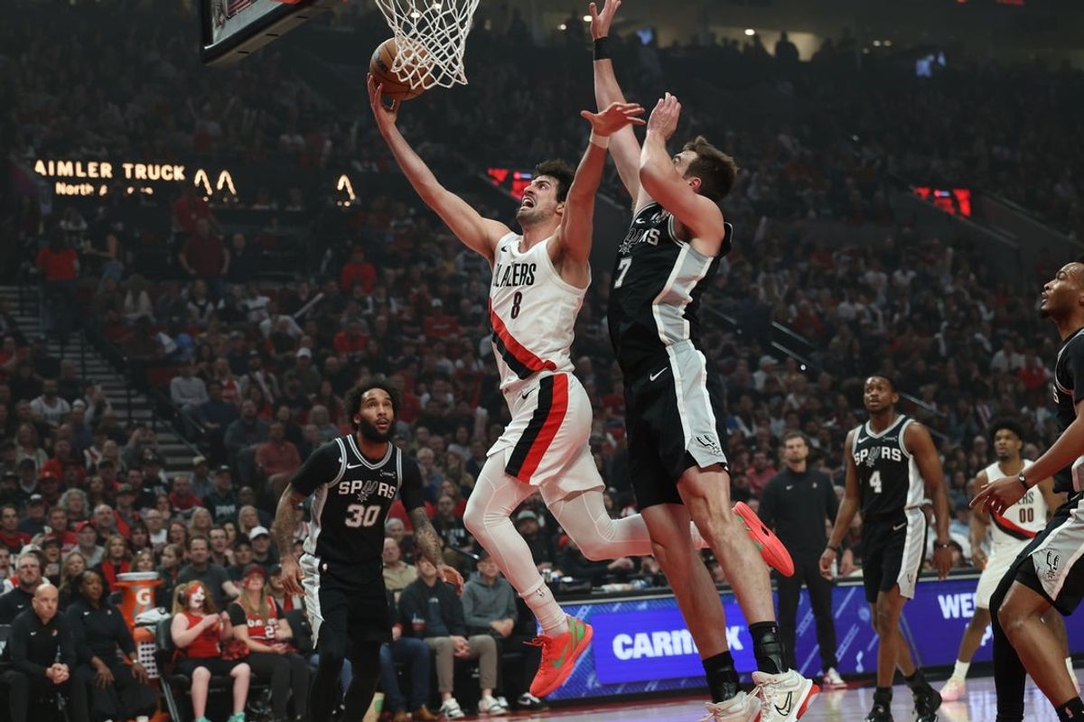 Apr 24, 2026; Portland, Oregon, USA; Portland Trail Blazers forward Deni Avdija (8) shoots the ball over San Antonio Spurs center Luke Kornet (7) during the first half of game three of the first round of the 2026 NBA Playoffs at Moda Center. Mandatory Credit: Jaime Valdez-Imagn Images