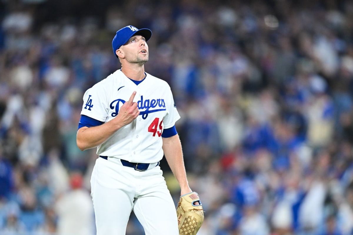 Apr 24, 2026; Los Angeles, California, USA; Los Angeles Dodgers pitcher Blake Treinen (49) reacts to a strike out during the eighth inning against the Chicago Cubs at Dodger Stadium. Mandatory Credit: William Liang-Imagn Images