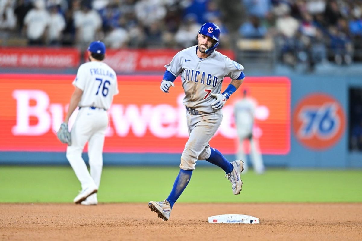 Apr 24, 2026; Los Angeles, California, USA; Chicago Cubs shortstop Dansby Swanson (7) rounds the bases after hitting a two run home run during the ninth inning against the Los Angeles Dodgers at Dodger Stadium. Mandatory Credit: William Liang-Imagn Images