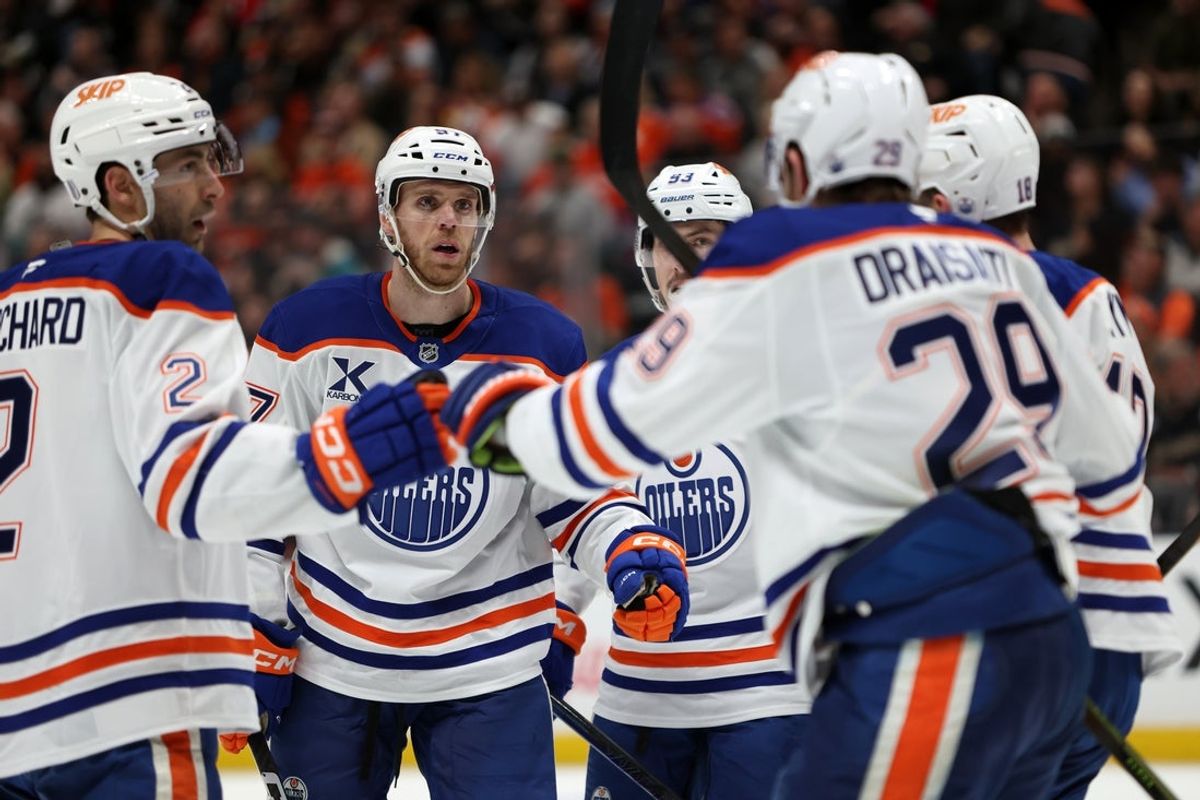 Apr 24, 2026; Anaheim, California, USA;  Edmonton Oilers center Connor McDavid (second from left) celebrates with teammates after scoring a a power play goal during the third period against the Anaheim Ducks in game three of the first round of the 2026 Stanley Cup Playoffs at Honda Center. Mandatory Credit: Kiyoshi Mio-Imagn Images