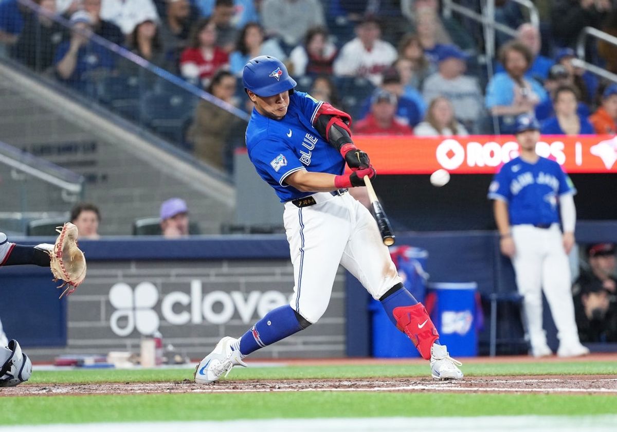Apr 25, 2026; Toronto, Ontario, CAN; Toronto Blue Jays third baseman Kazuma Okamoto (7) hits a home run against the Cleveland Guardians during the fourth inning at Rogers Centre. Mandatory Credit: Nick Turchiaro-Imagn Images