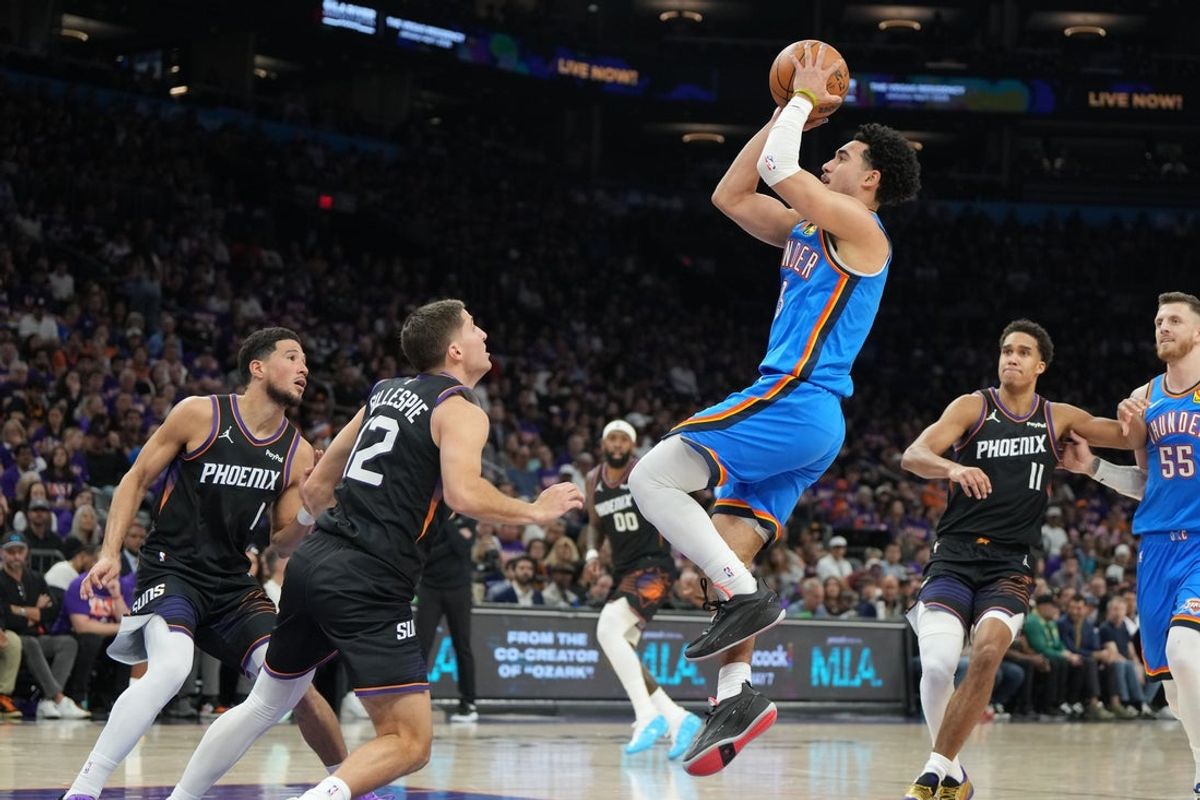 Apr 25, 2026; Phoenix, Arizona, USA; Oklahoma City Thunder guard Jared McCain (3) shoots against the Phoenix Suns in the first half during game three of the first round of the 2026 NBA Playoffs at Mortgage Matchup Center. Mandatory Credit: Rick Scuteri-Imagn Images