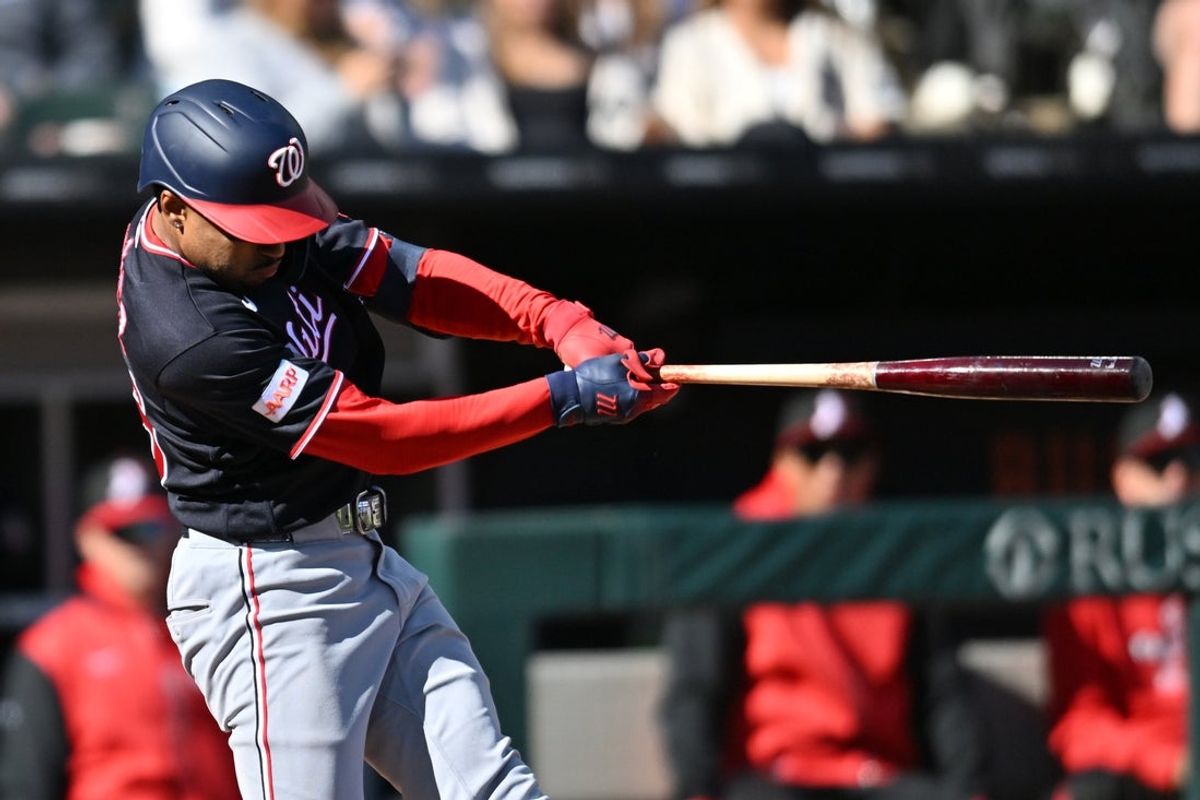 Apr 25, 2026; Chicago, Illinois, USA; Washington Nationals shortstop Nasim Nunez (26) hits a two-run single against the Chicago White Sox during the fourth inning at Rate Field. Mandatory Credit: Patrick Gorski-Imagn Images