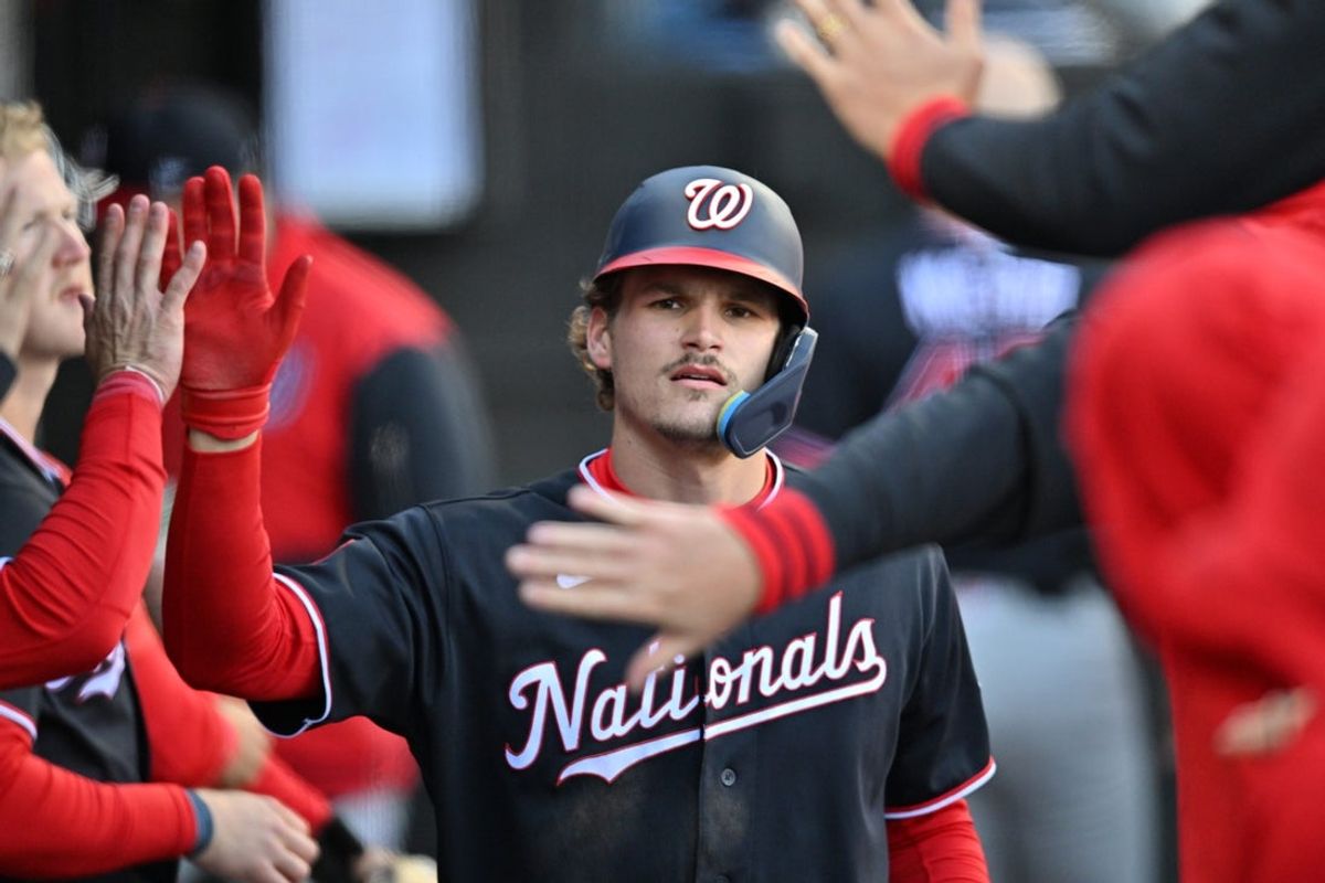 Apr 25, 2026; Chicago, Illinois, USA; Washington Nationals third baseman Brady House (12) celebrates with teammates in the dugout after scoring against the Chicago White Sox during the fourth inning at Rate Field. Mandatory Credit: Patrick Gorski-Imagn Images