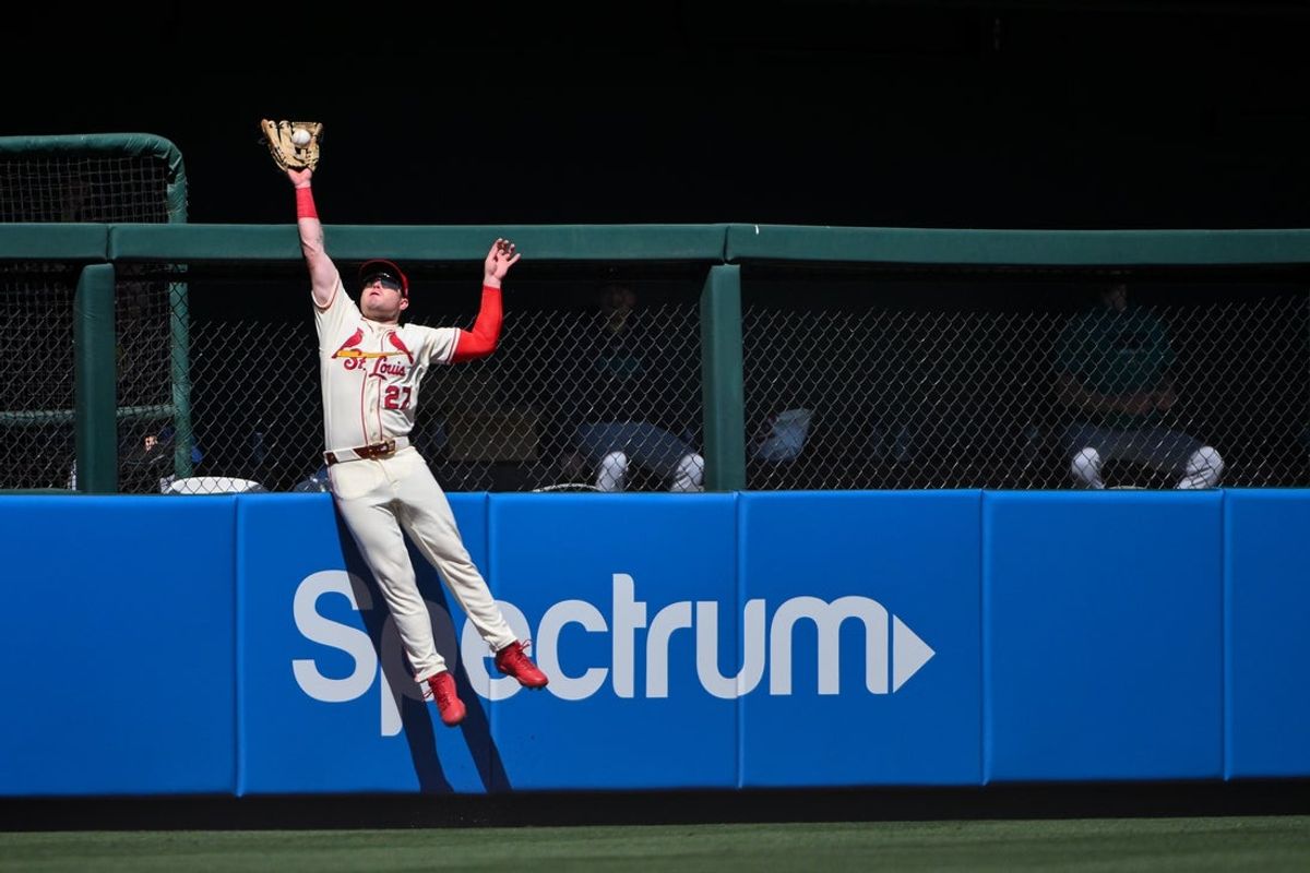 Apr 25, 2026; St. Louis, Missouri, USA; St. Louis Cardinals left fielder Nathan Church (27) leaps at the wall and robs a home run from Seattle Mariners catcher Mitch Garver (not pictured) during the sixth inning at Busch Stadium. Mandatory Credit: Jeff Curry-Imagn Images