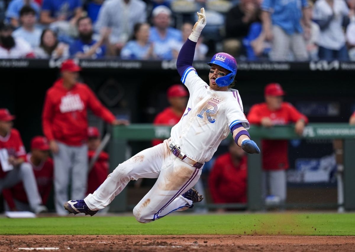 Apr 25, 2026; Kansas City, Missouri, USA; Kansas City Royals shortstop Bobby Witt Jr. (7) slides into home to score a run during the fourth inning against the Los Angeles Angels at Kauffman Stadium. Mandatory Credit: Jay Biggerstaff-Imagn Images