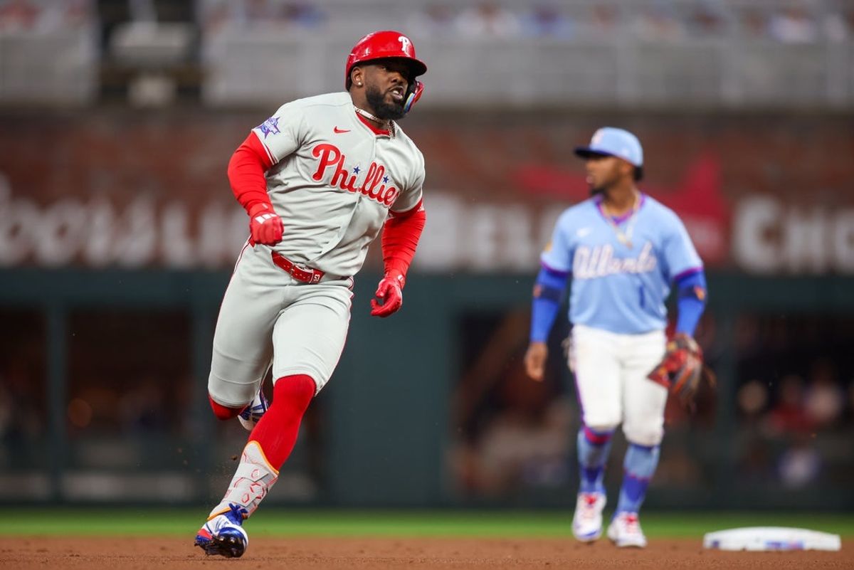 Apr 25, 2026; Atlanta, Georgia, USA; Philadelphia Phillies right fielder Adolis Garcia (53) runs to third on an RBI triple against the Atlanta Braves in the first inning at Truist Park. Mandatory Credit: Brett Davis-Imagn Images