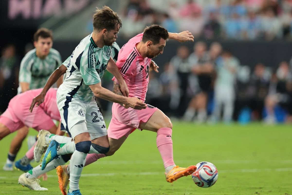 Apr 25, 2026; Miami, Florida, USA; Inter Miami CF forward Lionel Messi (10) dribbles the ball against New England Revolution defender Will Sands (23) during the first half at Nu Stadium. Mandatory Credit: Sam Navarro-Imagn Images