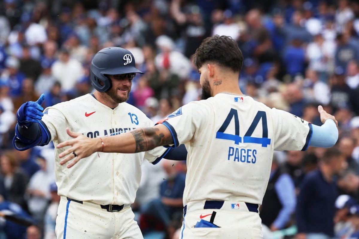Apr 25, 2026; Los Angeles, California, USA; Los Angeles Dodgers infielder Max Muncy (13) celebrates with outfielder Andy Pages (44) after hitting a two run home run against the Chicago Cubs during the third inning at Dodger Stadium. Mandatory Credit: Kiyoshi Mio-Imagn Images