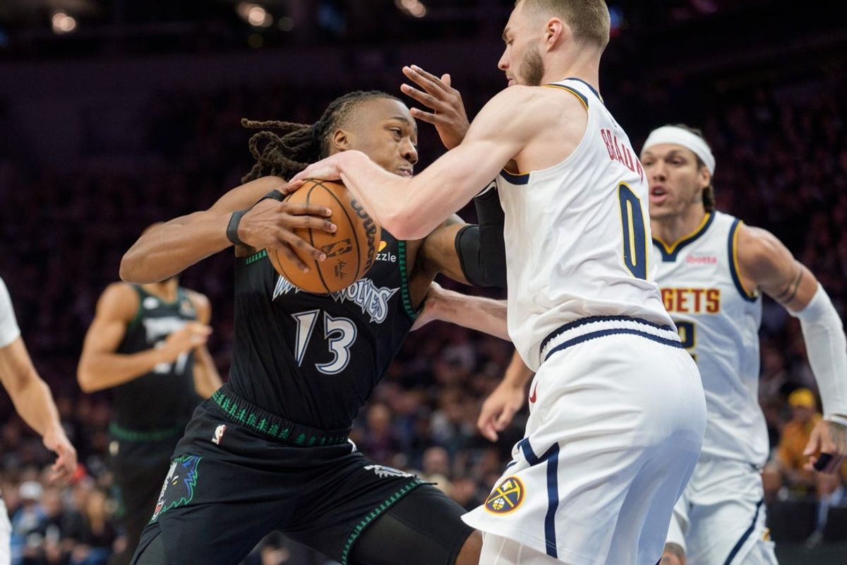 Apr 25, 2026; Minneapolis, Minnesota, USA; Denver Nuggets guard Christian Braun (0) defends against Minnesota Timberwolves guard Ayo Dosunmu (13) in the first quarter at Target Center. Mandatory Credit: Matt Blewett-Imagn Images
