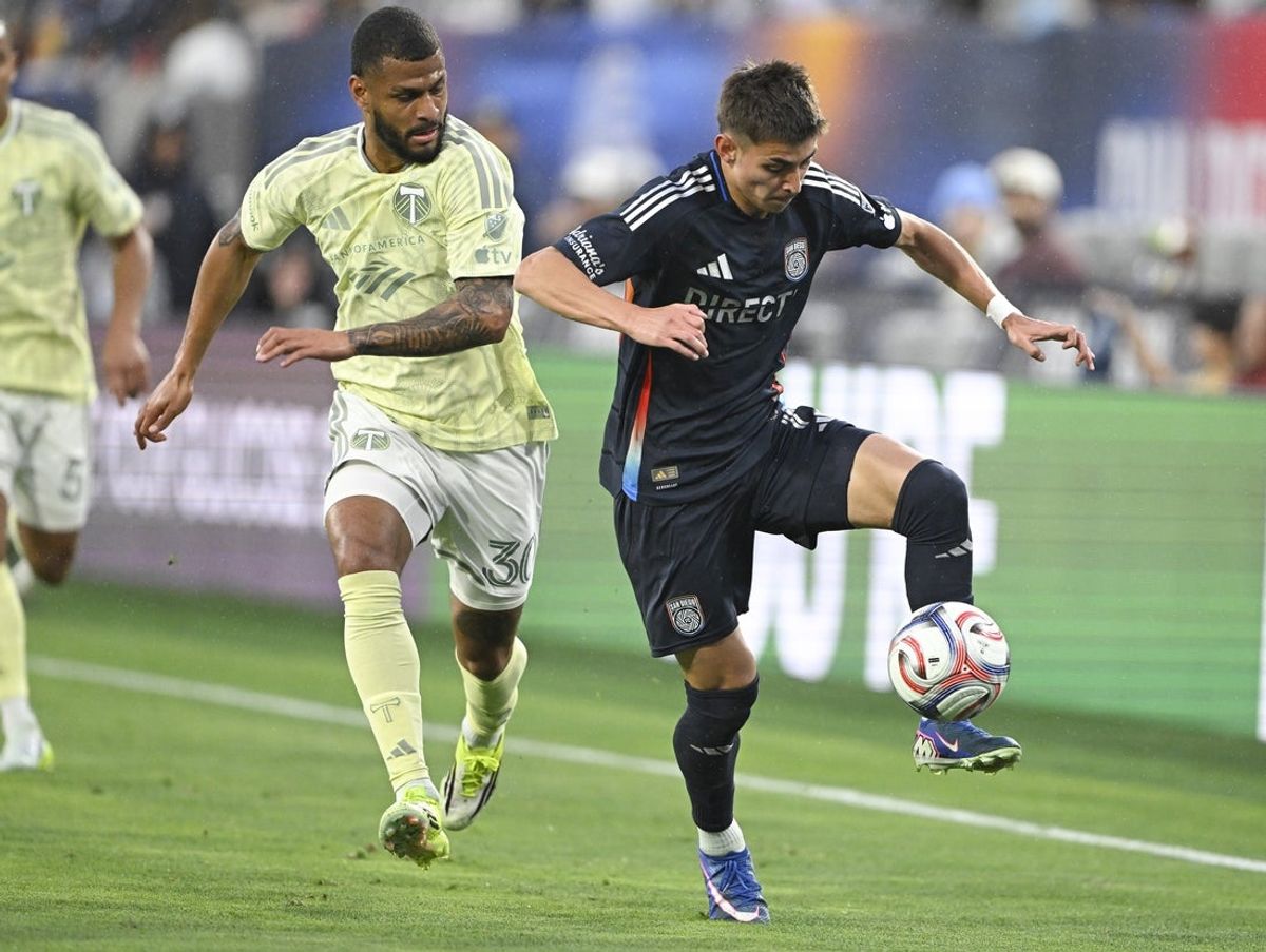 Apr 25, 2026; San Diego, California, USA; San Diego FC midfielder David Vazquez (19, right), fights for the ball with Portland Timbers midfielder José Caicedo (30) during the first half at Snapdragon Stadium. Mandatory Credit: Denis Poroy-Imagn Images