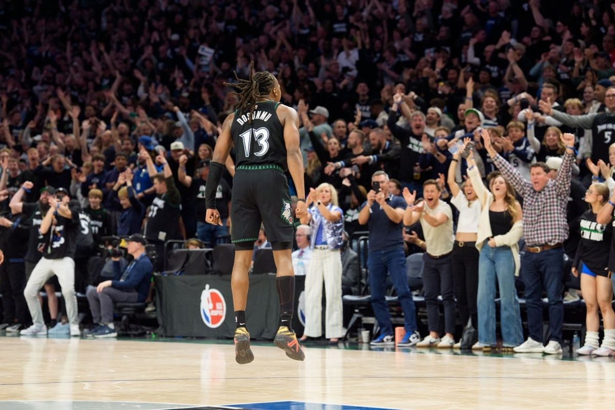 Apr 25, 2026; Minneapolis, Minnesota, USA; Minnesota Timberwolves guard Ayo Dosunmu (13) celebrates with fans after making a three-point shot against the Denver Nuggets in the fourth quarter at Target Center. Mandatory Credit: Matt Blewett-Imagn Images