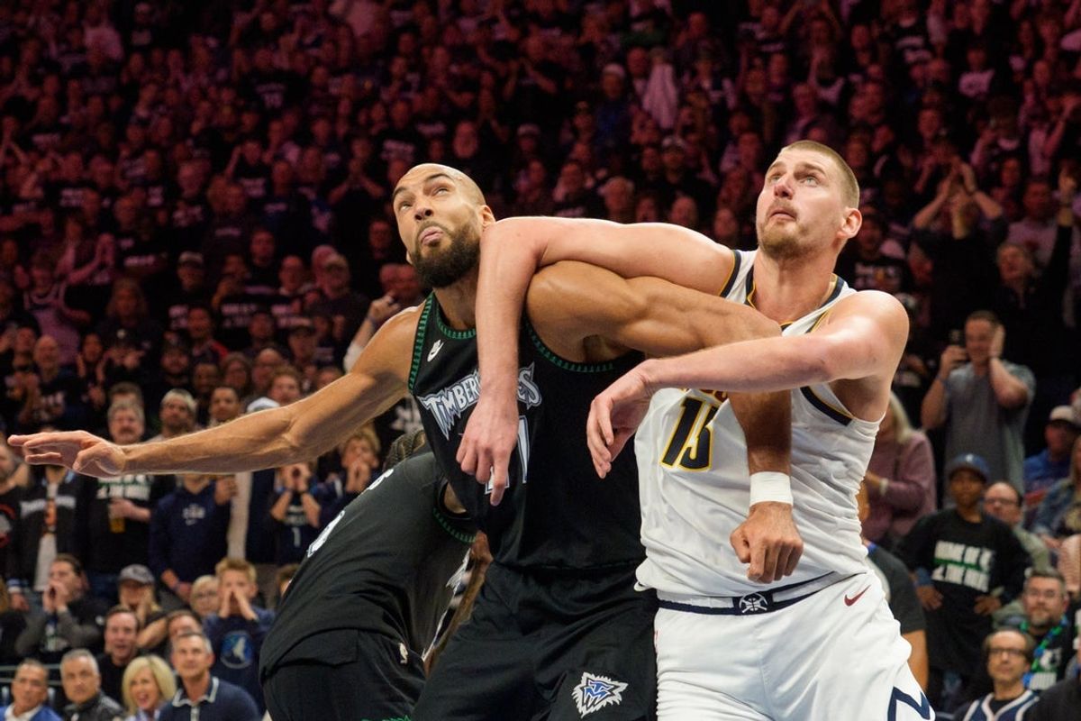 Apr 25, 2026; Minneapolis, Minnesota, USA; Minnesota Timberwolves center Rudy Gobert (27) and Denver Nuggets center Nikola Jokic (15) position themselves for a rebound in the fourth quarter at Target Center. Mandatory Credit: Matt Blewett-Imagn Images
