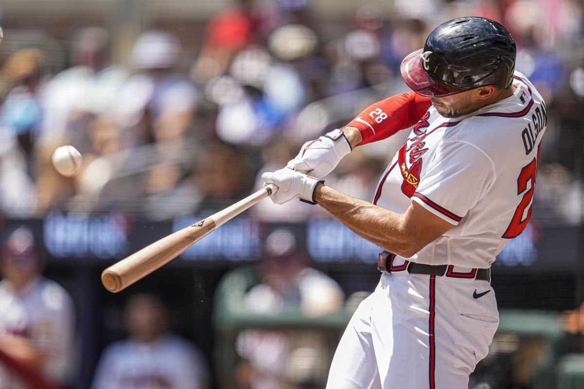 Apr 26, 2026; Cumberland, Georgia, USA; Atlanta Braves first baseman Matt Olson (28) hits a three run home run against the Philadelphia Phillies during the first inning at Truist Park. Mandatory Credit: Dale Zanine-Imagn Images