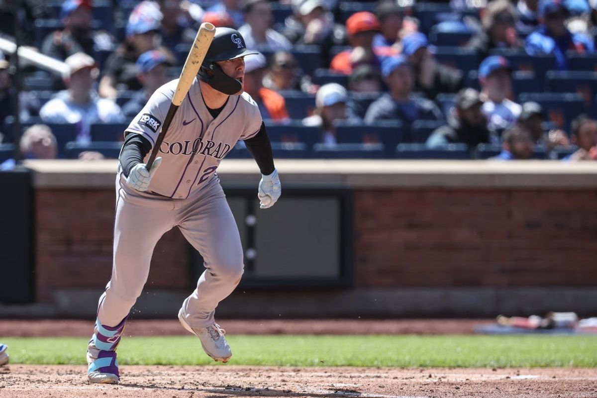 Apr 26, 2026; New York City, New York, USA;  Colorado Rockies first baseman Troy Johnston (20) hits an RBI single in the fourth inning against the New York Mets at Citi Field. Mandatory Credit: Wendell Cruz-Imagn Images