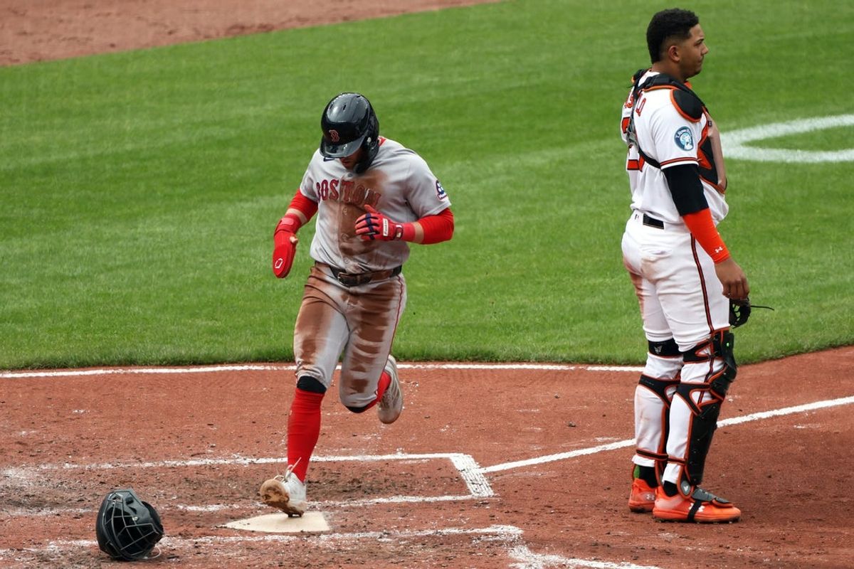Apr 26, 2026; Baltimore, Maryland, USA; Boston Red Sox third baseman Caleb Durbin (5) scores during the fifth inning against the Baltimore Orioles at Oriole Park at Camden Yards. Mandatory Credit: Daniel Kucin Jr.-Imagn Images
