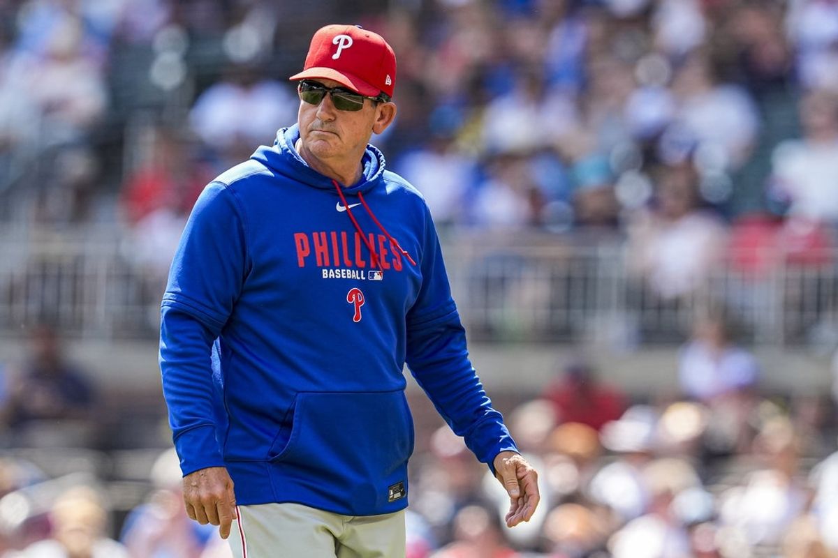Apr 26, 2026; Cumberland, Georgia, USA; Philadelphia Phillies manager Rob Thomson (49) on the field during the game against the Atlanta Braves at Truist Park. Mandatory Credit: Dale Zanine-Imagn Images