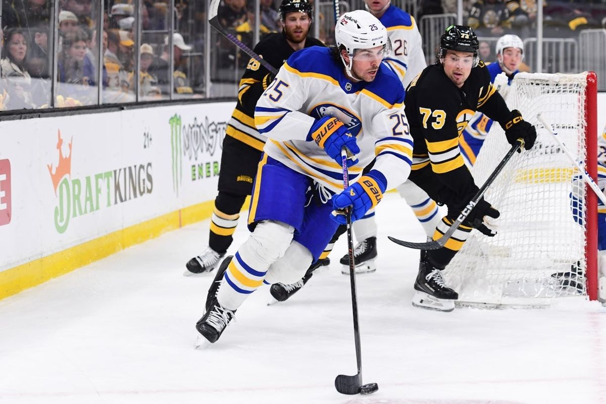 Apr 26, 2026; Boston, Massachusetts, USA; Buffalo Sabres defenseman Owen Power (25) skates with the puck ahead of Boston Bruins defenseman Charlie McAvoy (73) during the third period in game four of the first round of the 2026 Stanley Cup Playoffs at TD Garden. Mandatory Credit: Bob DeChiara-Imagn Images