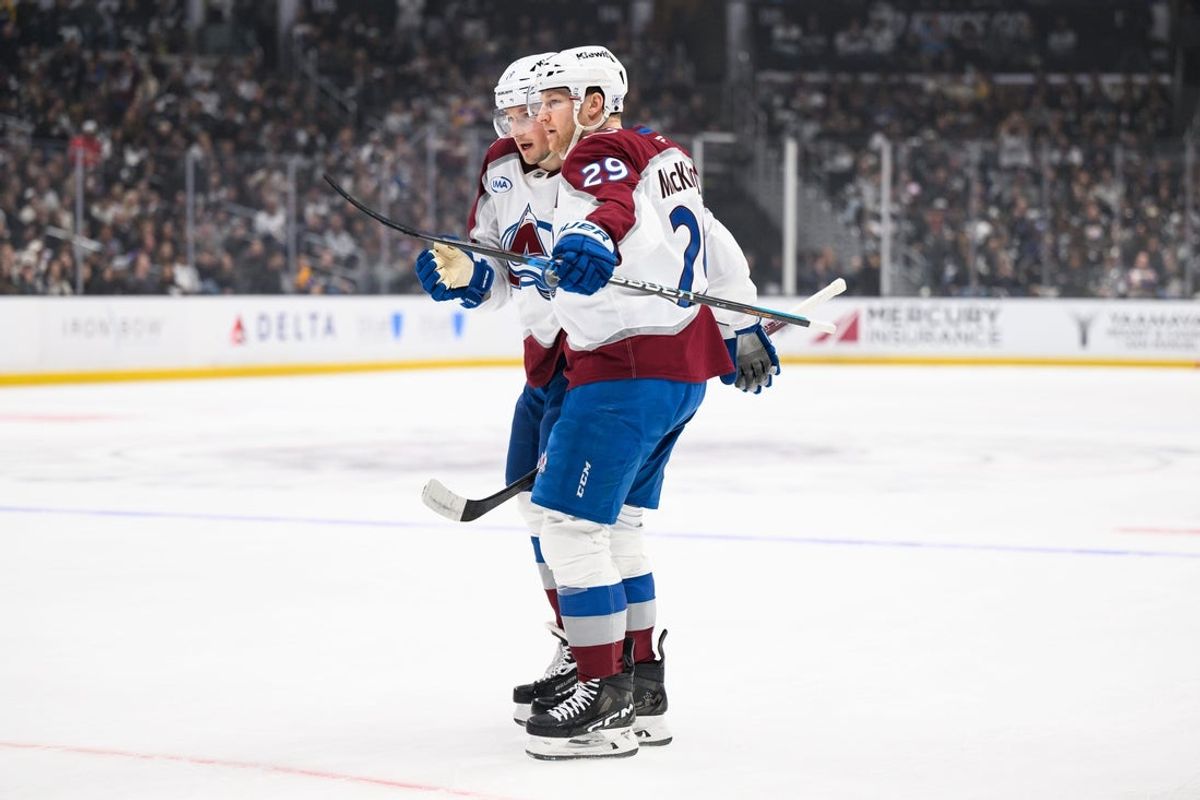 Apr 26, 2026; Los Angeles, California, USA; Colorado Avalanche center Nathan MacKinnon (29) is greeted by defenseman Cale Makar (8) after scoring during the first period in game four of the first round of the 2026 Stanley Cup Playoffs against the Los Angeles Kings at Crypto.com Arena. Mandatory Credit: William Liang-Imagn Images