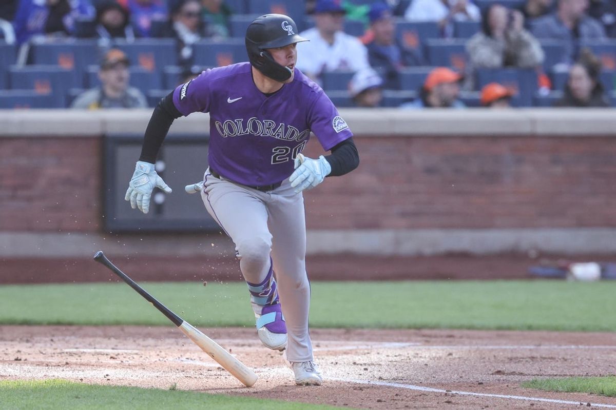 Apr 26, 2026; New York City, New York, USA;  Colorado Rockies designated hitter Troy Johnston (20) hits an RBI single in the second inning against the New York Mets at Citi Field. Mandatory Credit: Wendell Cruz-Imagn Images