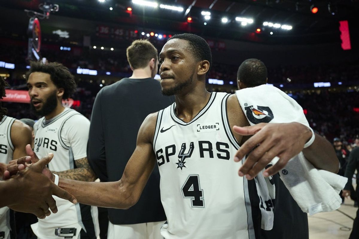 Apr 26, 2026; Portland, Oregon, USA; San Antonio Spurs guard De'aaron Fox (4) celebrates with teammates after a game against the Portland Trail Blazers during game four of the first round of the 2026 NBA Playoffs at Moda Center. Mandatory Credit: Troy Wayrynen-Imagn Images