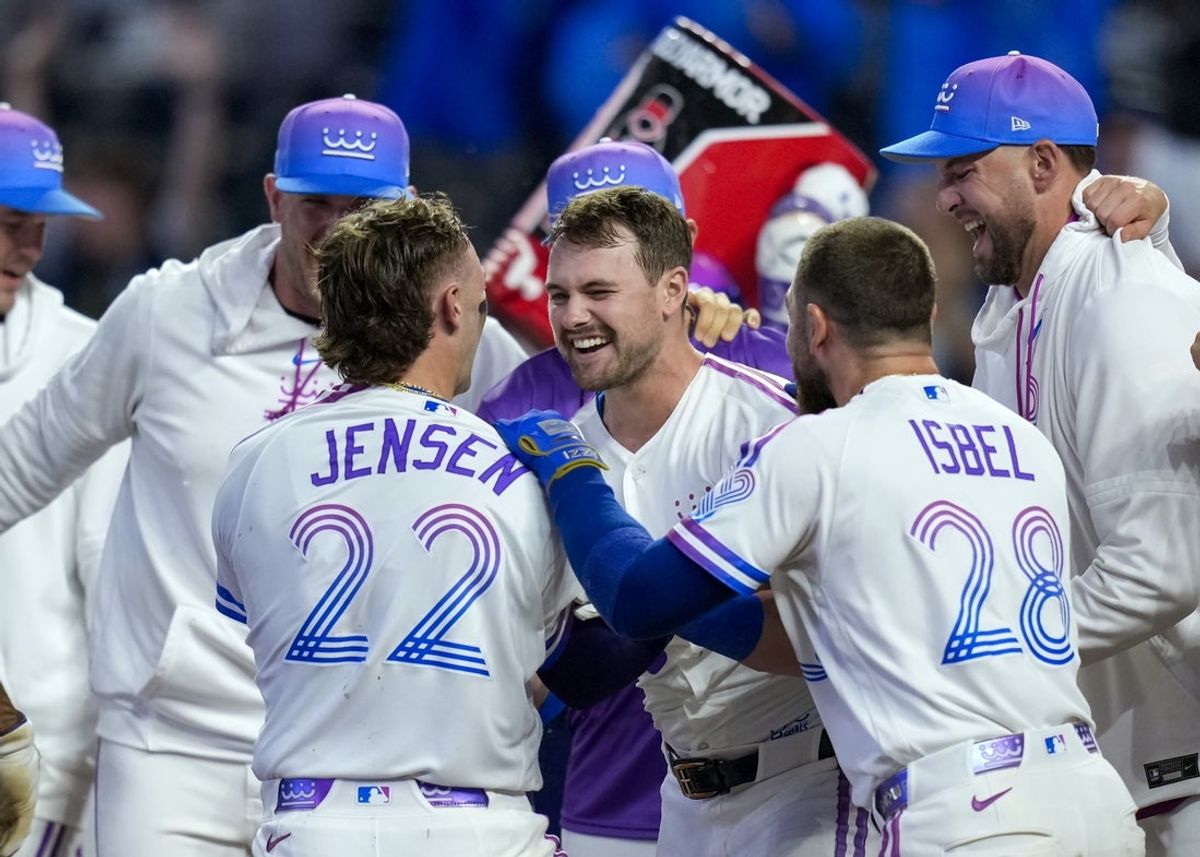 Apr 26, 2026; Kansas City, Missouri, USA; Kansas City Royals center fielder Lane Thomas (15) celebrates with teammates after hitting a walk-off home run during the tenth inning against the Los Angeles Angels at Kauffman Stadium. Mandatory Credit: Jay Biggerstaff-Imagn Images