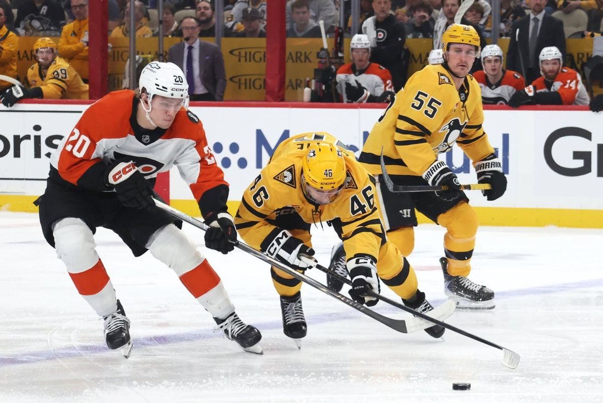 Apr 27, 2026; Pittsburgh, Pennsylvania, USA;  Philadelphia Flyers left wing Alex Bump (20) and Pittsburgh Penguins center Blake Lizotte (46) battle for the puck during the first period in game five of the first round of the 2026 Stanley Cup Playoffs at PPG Paints Arena. Mandatory Credit: Charles LeClaire-Imagn Images