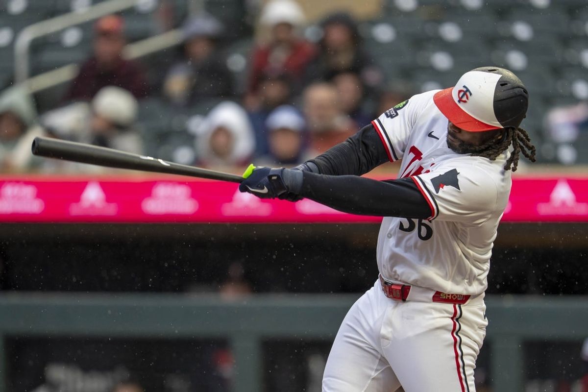Apr 27, 2026; Minneapolis, Minnesota, USA; Minnesota Twins designated hitter Josh Bell (56) hits a single against the Seattle Mariners in the second inning at Target Field. Mandatory Credit: Jesse Johnson-Imagn Images