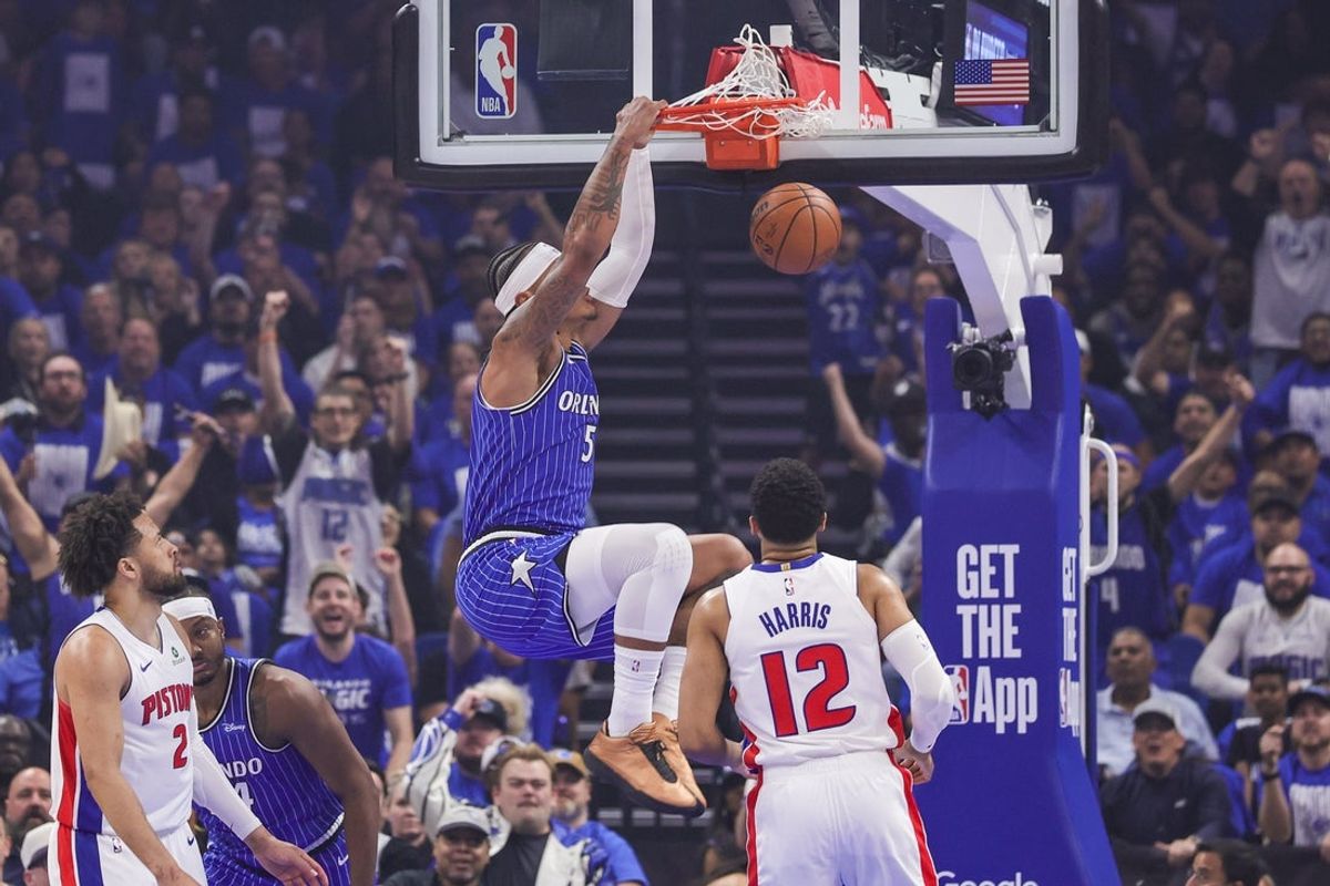 Apr 27, 2026; Orlando, Florida, USA; Orlando Magic forward Paolo Banchero (5) dunks in front of Detroit Pistons forward Tobias Harris (12) during the first quarter during game four of the first round of the 2026 NBA Playoffs at Kia Center. Mandatory Credit: Mike Watters-Imagn Images