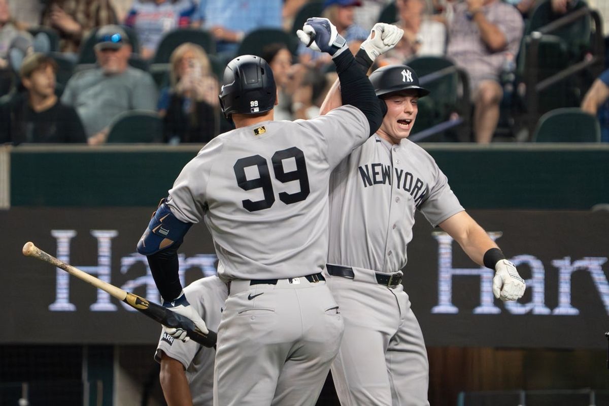 Apr 27, 2026; Arlington, Texas, USA; New York Yankees first baseman Ben Rice (22) bumps elbows with right fielder Aaron Judge (99) after hitting two-run home run against the Texas Rangers during the third inning at Globe Life Field. Mandatory Credit: Raymond Carlin III-Imagn Images