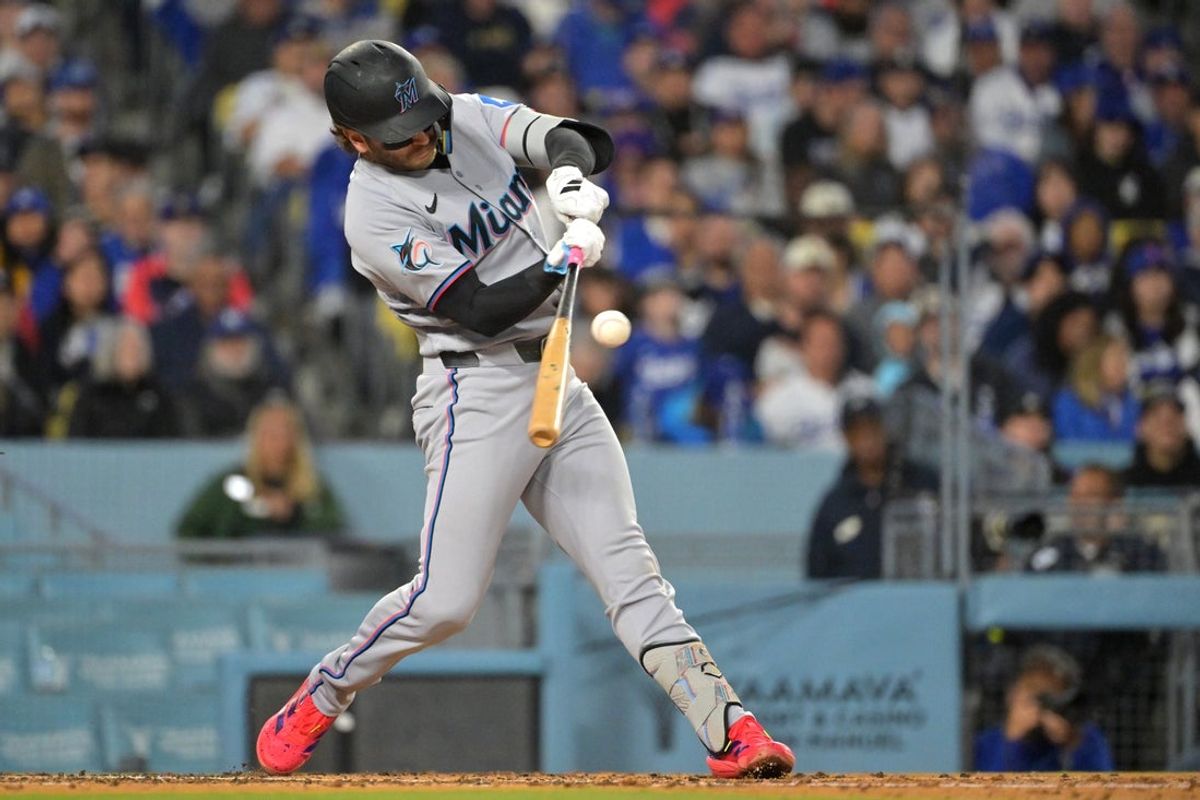 Apr 27, 2026; Los Angeles, California, USA; Miami Marlins third baseman Connor Norby (1) hits a single against the Los Angeles Dodgers in the third inning at Dodger Stadium. Mandatory Credit: Jayne Kamin-Oncea-Imagn Images