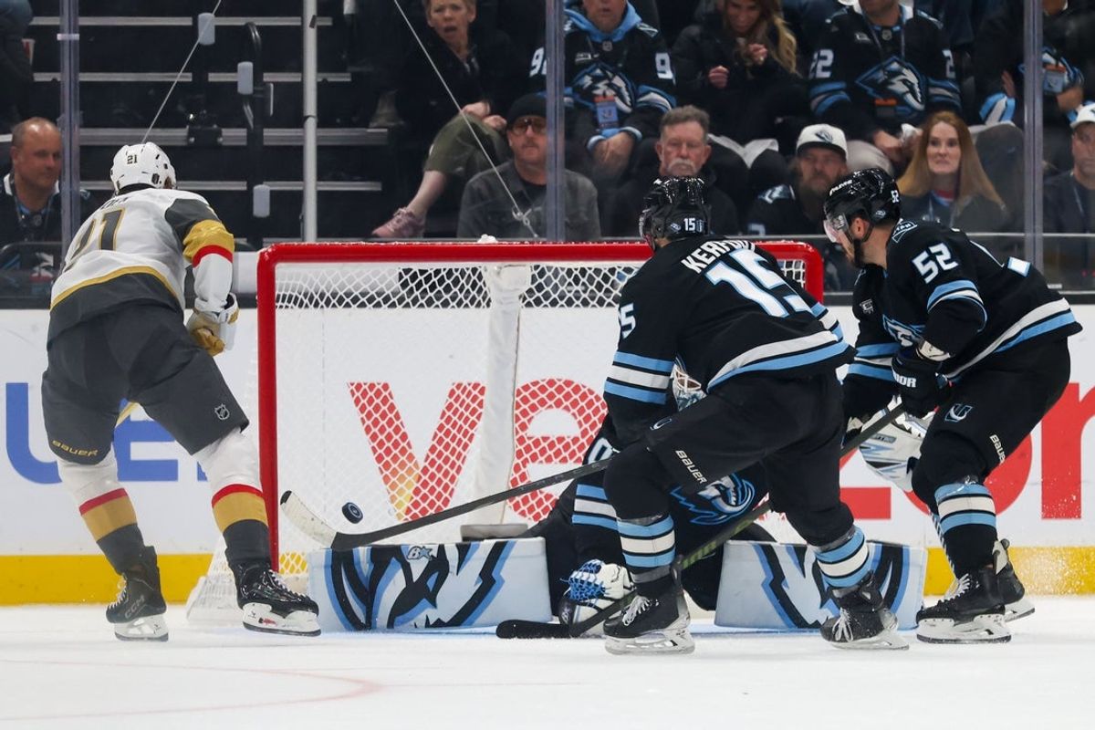 Apr 27, 2026; Salt Lake City, Utah, USA; Vegas Golden Knights center Brett Howden (21) shoots and scores against Utah Mammoth goaltender Karel Vejmelka (70), center Alexander Kerfoot (15) and defenseman MacKenzie Weegar (52) during the first period in game four of the first round of the 2026 Stanley Cup Playoffs at Delta Center. Mandatory Credit: Rob Gray-Imagn Images