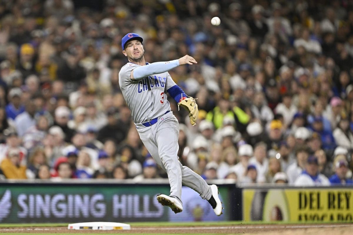 Apr 27, 2026; San Diego, California, USA; Chicago Cubs third baseman Alex Bregman (3) throws to first base but can’t get the out on San Diego Padres right fielder Ramon Laureano (5) during the fourth inning at Petco Park. Mandatory Credit: Denis Poroy-Imagn Images