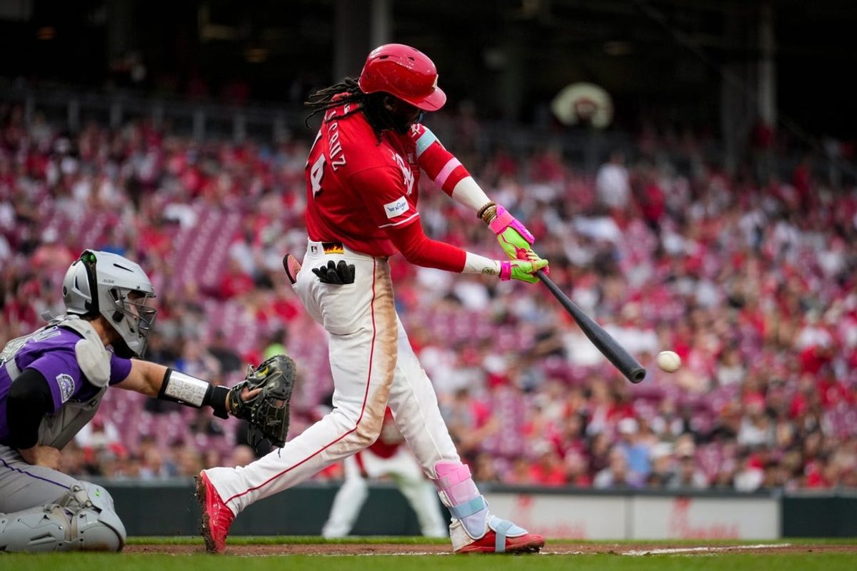 Cincinnati Reds shortstop Elly de la Cruz (44) hits an RBI single to center field, scoring Dane Myers from second base, in the third inning of the MLB National League game between the Cincinnati Reds and the Colorado Rockies at Great American Ball Park in downtown Cincinnati on Tuesday, April 28, 2026. The Reds led 4-1 after three innings.