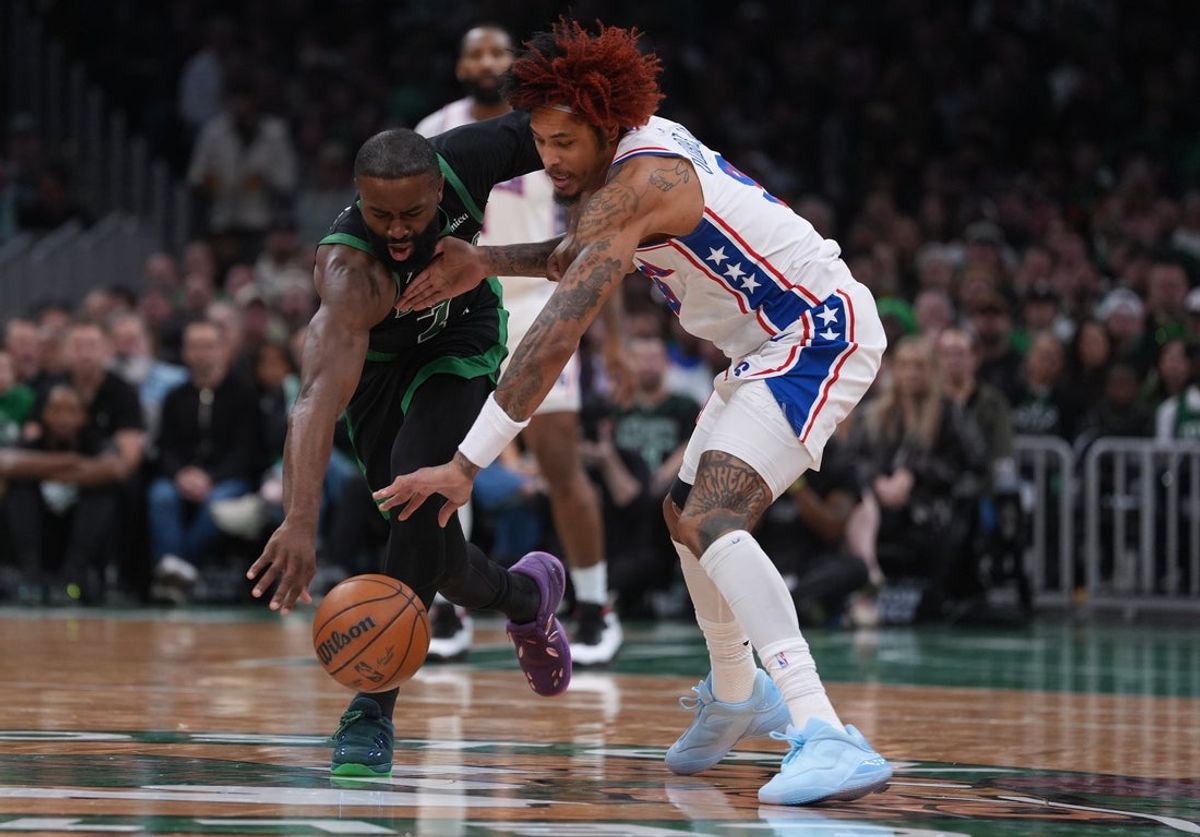 Apr 28, 2026; Boston, Massachusetts, USA; Boston Celtics guard Jaylen Brown (7) and Philadelphia 76ers guard Kelly Oubre Jr. (9) work for the ball in the second quarter during game five of the first round of the 2026 NBA Playoffs at TD Garden. Mandatory Credit: David Butler II-Imagn Images