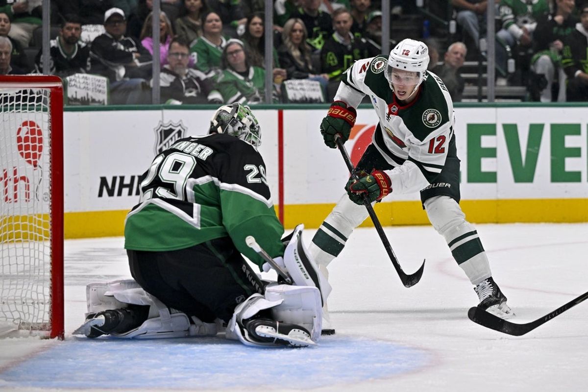 Apr 28, 2026; Dallas, Texas, USA; Minnesota Wild left wing Matt Boldy (12) looks to move the puck past Dallas Stars goaltender Jake Oettinger (29) during the first period in game five of the first round of the 2026 Stanley Cup Playoffs at American Airlines Center. Mandatory Credit: Jerome Miron-Imagn Images