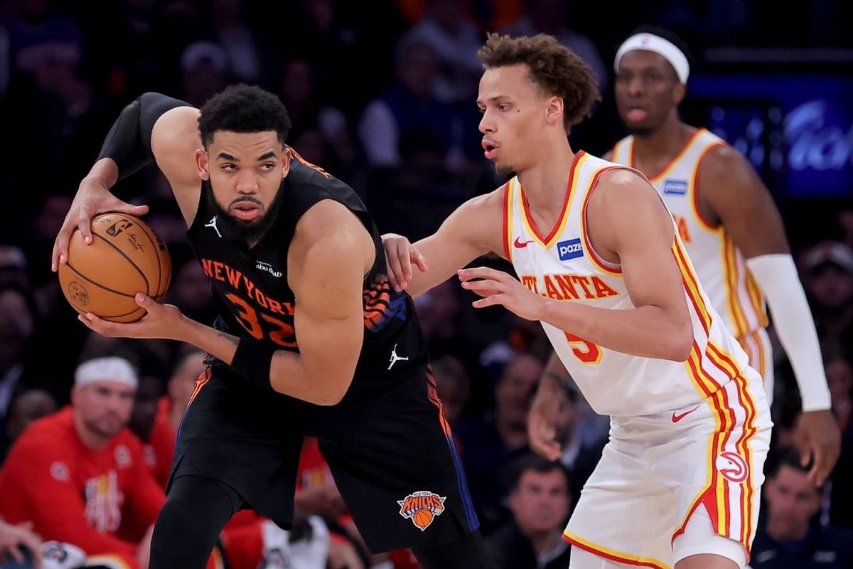 Apr 28, 2026; New York, New York, USA; New York Knicks center Karl-Anthony Towns (32) controls the ball against Atlanta Hawks guard Dyson Daniels (5) during the third quarter of game five of the first round of the 2026 NBA Playoffs at Madison Square Garden. Mandatory Credit: Brad Penner-Imagn Images