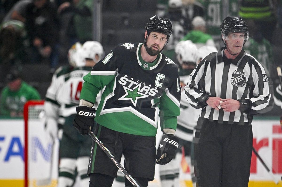 Apr 28, 2026; Dallas, Texas, USA; Dallas Stars left wing Jamie Benn (14) skates off the ice as the Minnesota Wild celebrate their win over the Stars in game five of the first round of the 2026 Stanley Cup Playoffs at American Airlines Center. Mandatory Credit: Jerome Miron-Imagn Images