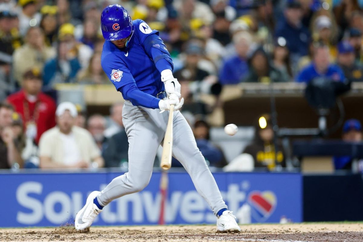 Apr 28, 2026; San Diego, California, USA; Chicago Cubs shortstop Nico Hoerner (2) hits a two-run double during the sixth inning against the San Diego Padres at Petco Park. Mandatory Credit: David Frerker-Imagn Images