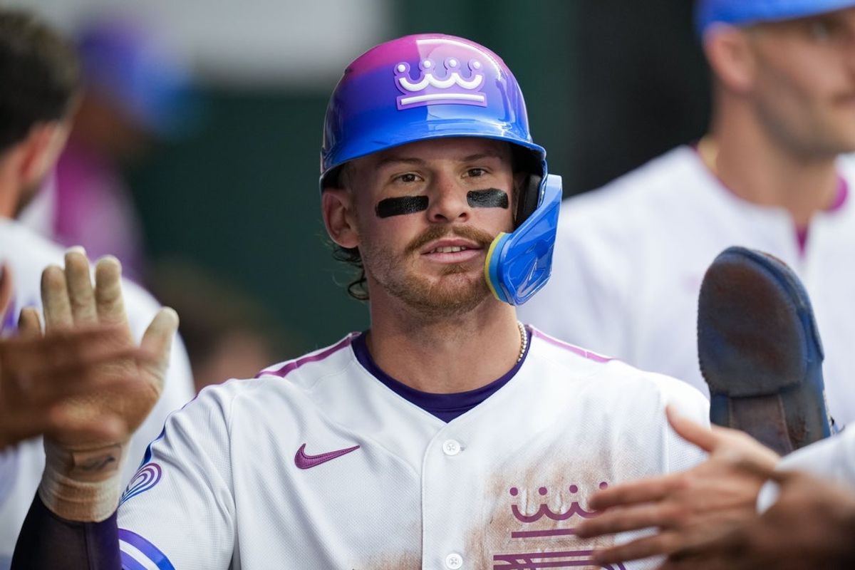 Apr 25, 2026; Kansas City, Missouri, USA; Kansas City Royals shortstop Bobby Witt Jr. (7) is congratulated by teammates after scoring a run during the third inning against the Los Angeles Angels at Kauffman Stadium. Mandatory Credit: Jay Biggerstaff-Imagn Images