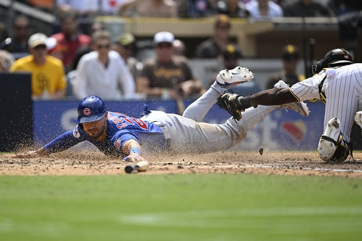 Apr 29, 2026; San Diego, California, USA; Chicago Cubs left fielder Michael Conforto (20) scores ahead of the tag of San Diego Padres catcher Luis Campusano (12) during the sixth inning at Petco Park. Mandatory Credit: Denis Poroy-Imagn Images
