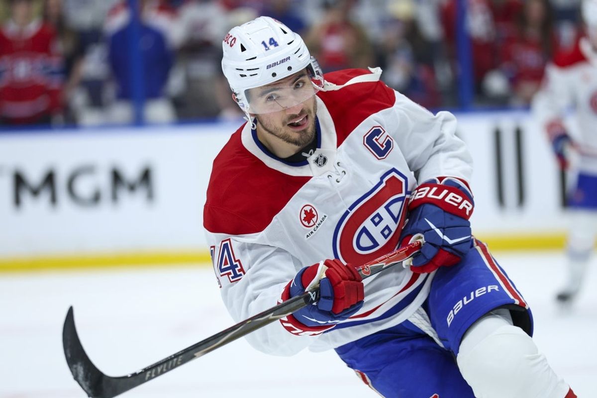 Apr 29, 2026; Tampa, Florida, USA; Montreal Canadiens center Nick Suzuki (14) warms up before a game against the before a game against the Tampa Bay Lightning in game five of the first round of the 2026 Stanley Cup Playoffs at Benchmark International Arena. Mandatory Credit: Nathan Ray Seebeck-Imagn Images