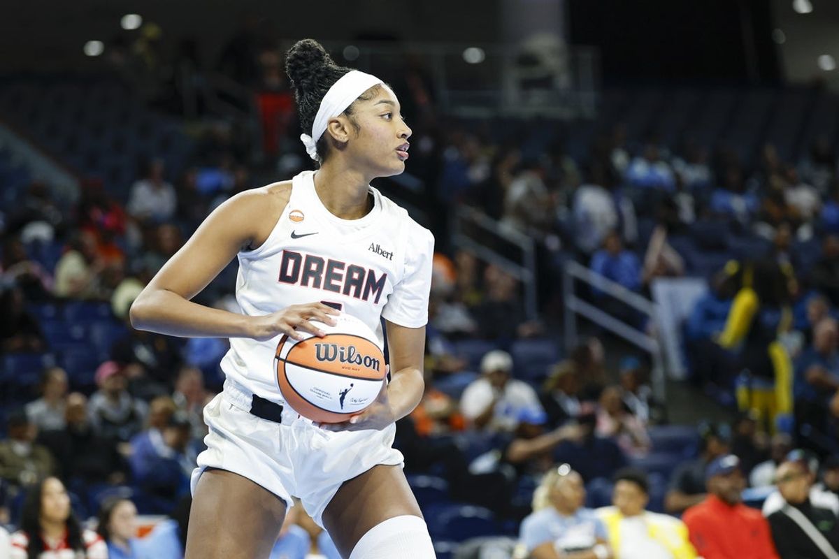 Apr 29, 2026; Chicago, IL, USA; Atlanta Dream forward Angel Reese (5) looks to pass the ball against the Chicago Sky during the first half of a WNBA preseason game at Wintrust Arena. Mandatory Credit: Kamil Krzaczynski-Imagn Images