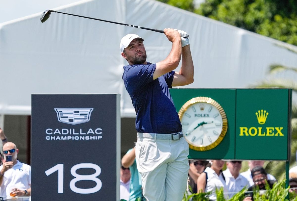 Apr 30, 2026; Miami, Florida, USA; Scottie Scheffler watches his tee shot on the 18th hole during the first round of the Cadillac Championship golf tournament. Mandatory Credit: Jeff Romance-Imagn Images