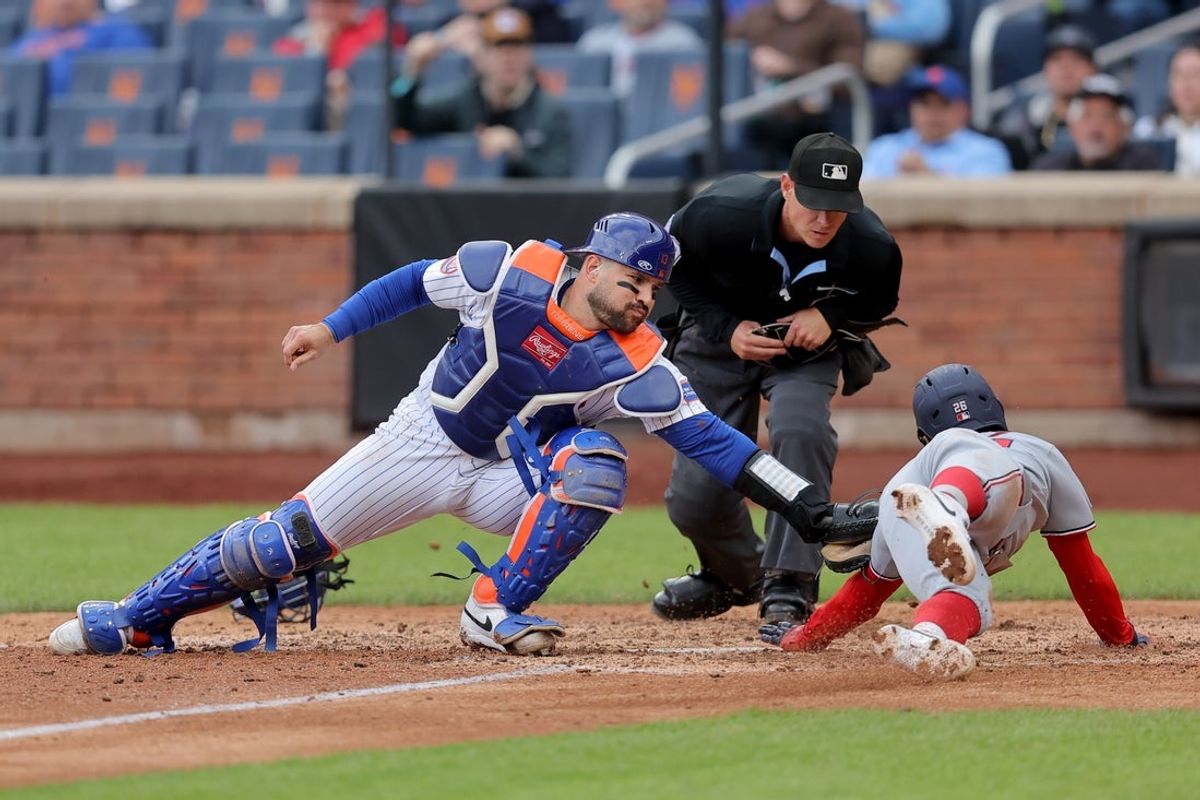 Apr 30, 2026; New York City, New York, USA; New York Mets catcher Luis Torrens (13) tags out Washington Nationals second baseman Nasim Nunez (26) trying to score on a fielder's choice by Nationals center fielder Jacob Young (not pictured) during the ninth inning at Citi Field. Mandatory Credit: Brad Penner-Imagn Images