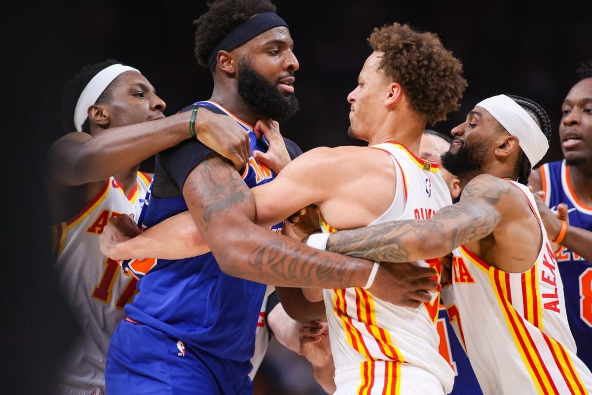 Apr 30, 2026; Atlanta, Georgia, USA; New York Knicks center Mitchell Robinson (23) scuffles with Atlanta Hawks guard Dyson Daniels (5) as forward Onyeka Okongwu (17) and guard Nickeil Alexander-Walker (7) attempt to hold them back in the second quarter during game six of the first round of the 2026 NBA Playoffs at State Farm Arena. Mandatory Credit: Brett Davis-Imagn Images