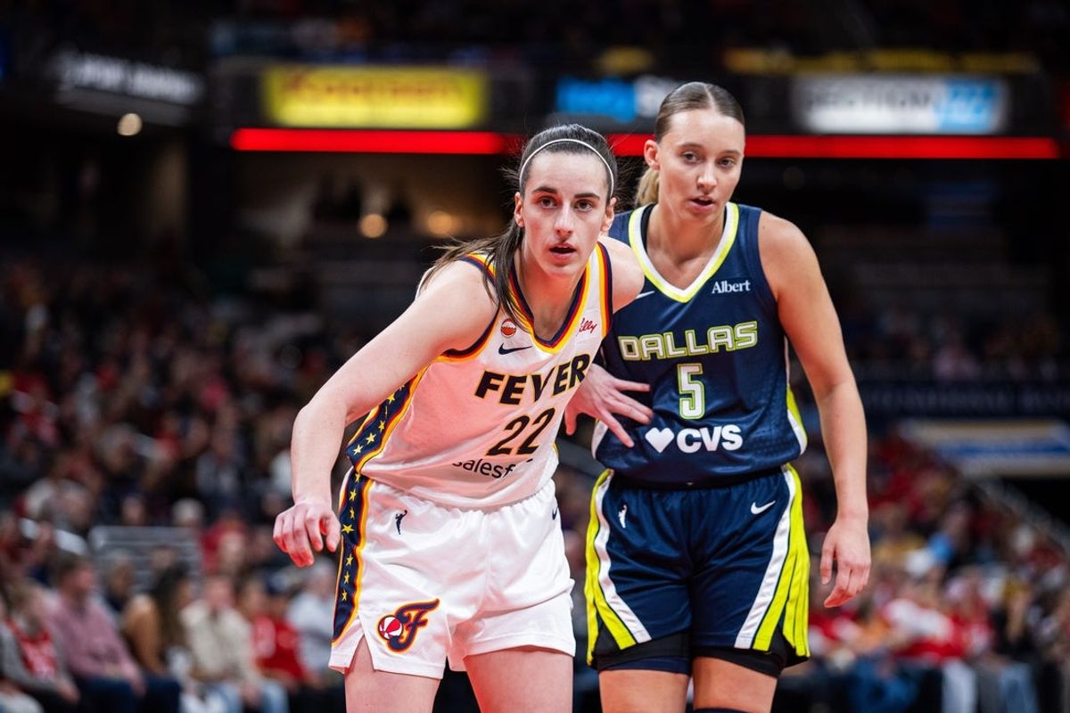 Apr 30, 2026; Indianapolis, IN, USA;  Indiana Fever guard Caitlin Clark (22) and Dallas Wings guard Paige Bueckers (5) during an inbounds play in the first half at the Gainbridge Fieldhouse. Mandatory Credit: Trevor Ruszkowski-Imagn Images