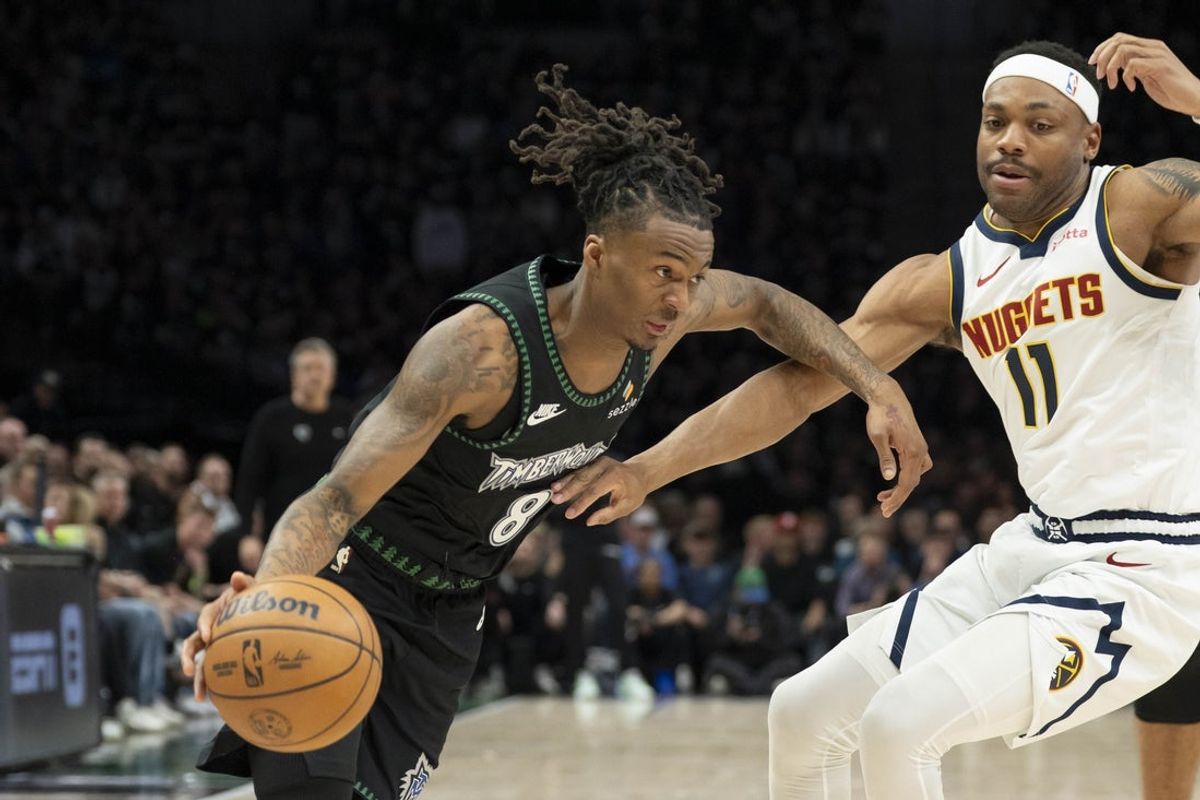 Apr 30, 2026; Minneapolis, Minnesota, USA; Minnesota Timberwolves guard Bones Hyland (8) dribbles the ball past Denver Nuggets guard Bruce Brown (11) in the first half during game six of the first round of the 2026 NBA Playoffs at Target Center. Mandatory Credit: Jesse Johnson-Imagn Images