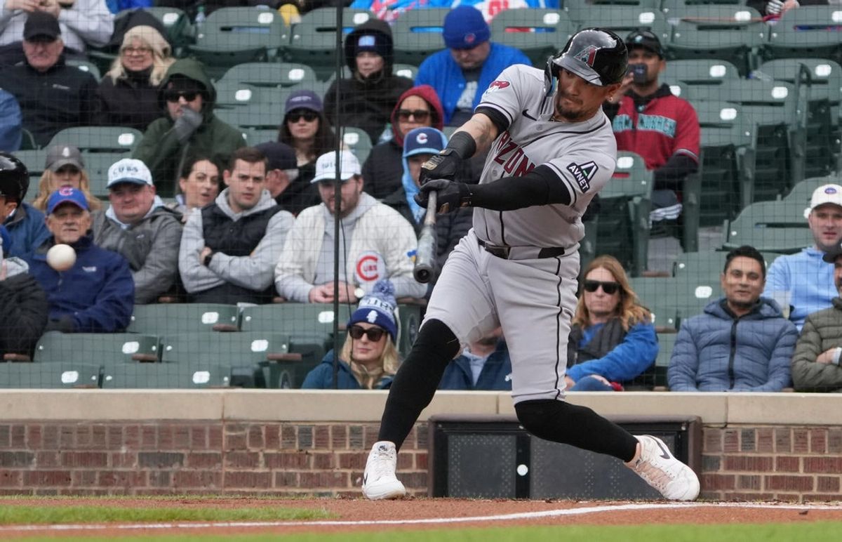 May 1, 2026; Chicago, Illinois, USA; Arizona Diamondbacks second baseman Ildemaro Vargas (6) hits a single against the Chicago Cubs during the first inning at Wrigley Field. Mandatory Credit: David Banks-Imagn Images